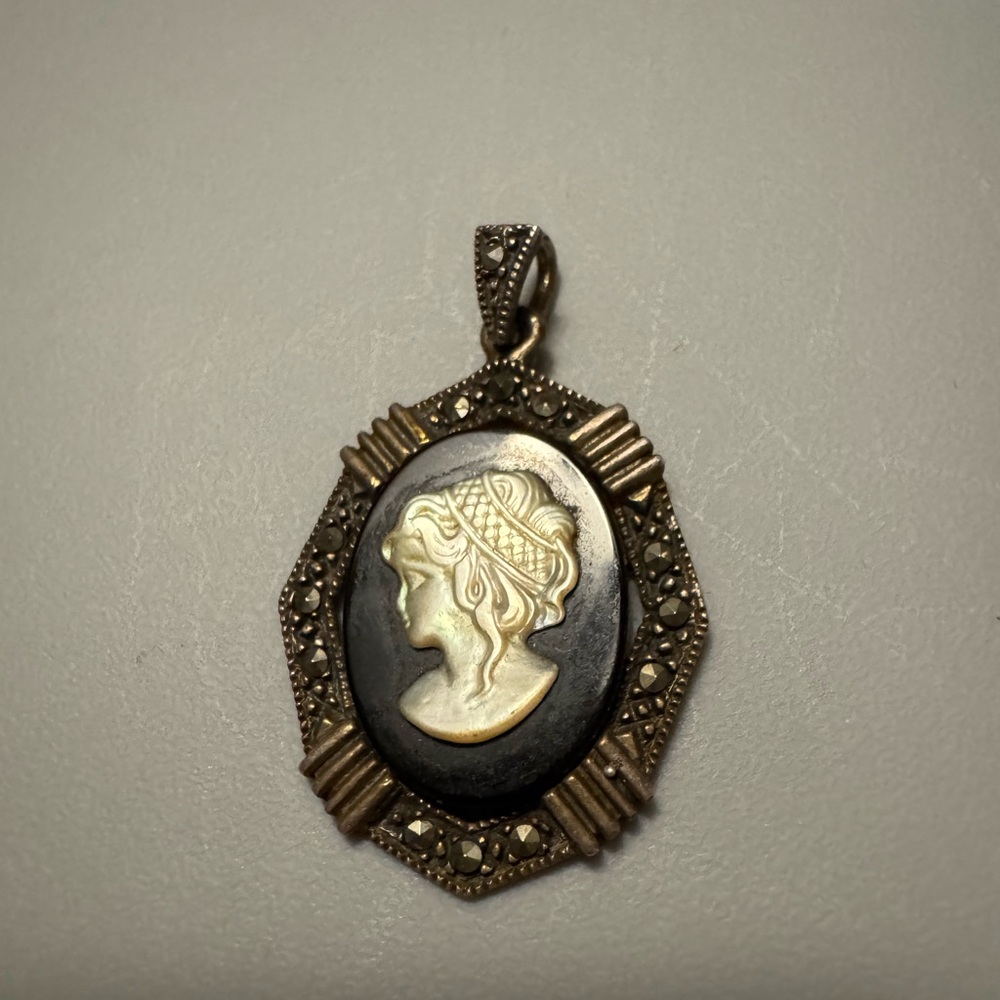 Vintage Cameo Pendant with silver accents.
